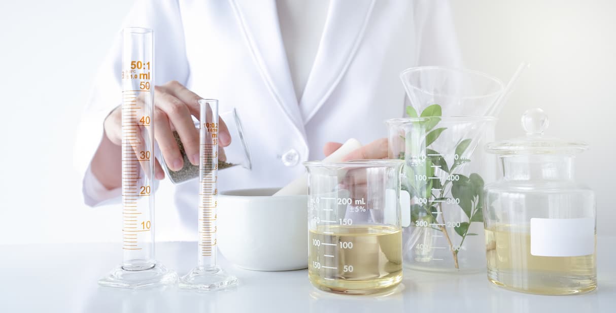 Lab technician applying Dermatonics cream to her hand for testing the creaminess and smooth consistency